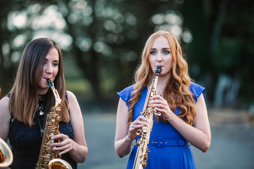 NI Saxophone Quartet together posed with saxes colour in a circle playing Bethany and Jenna